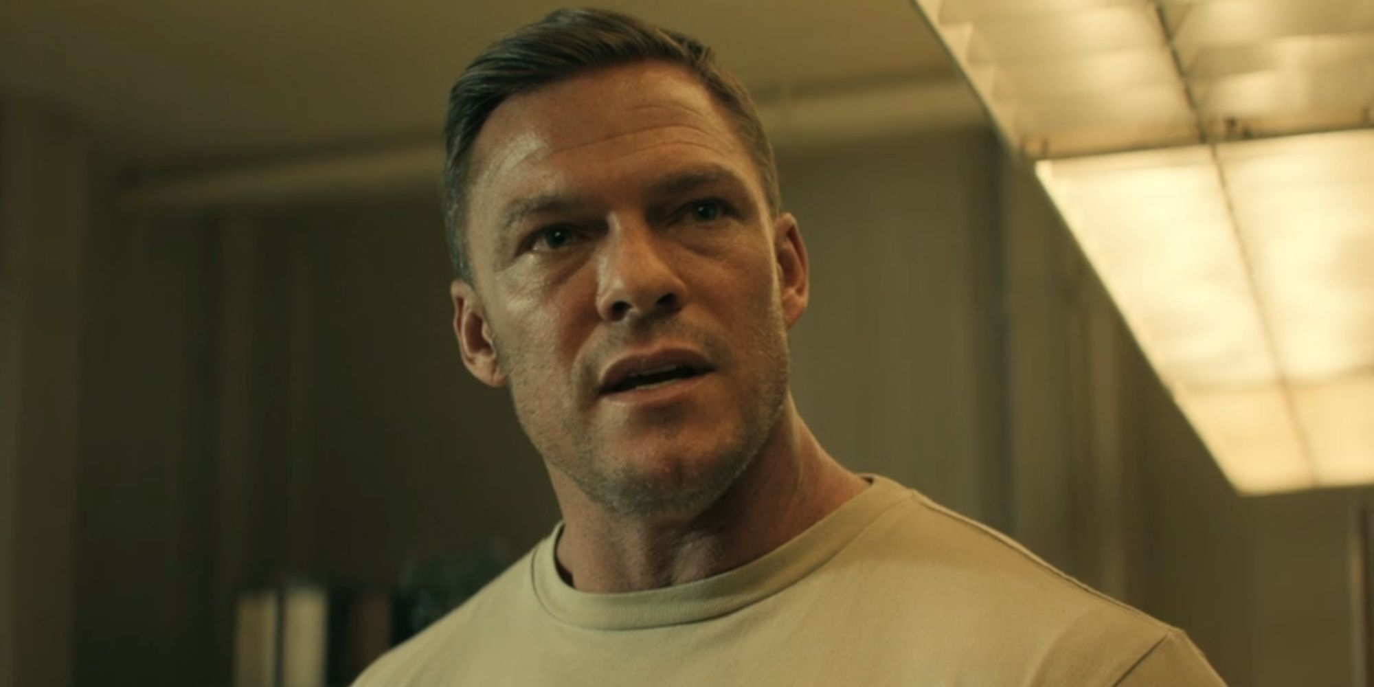 Alan Ritchson looking annoyed as Reacher