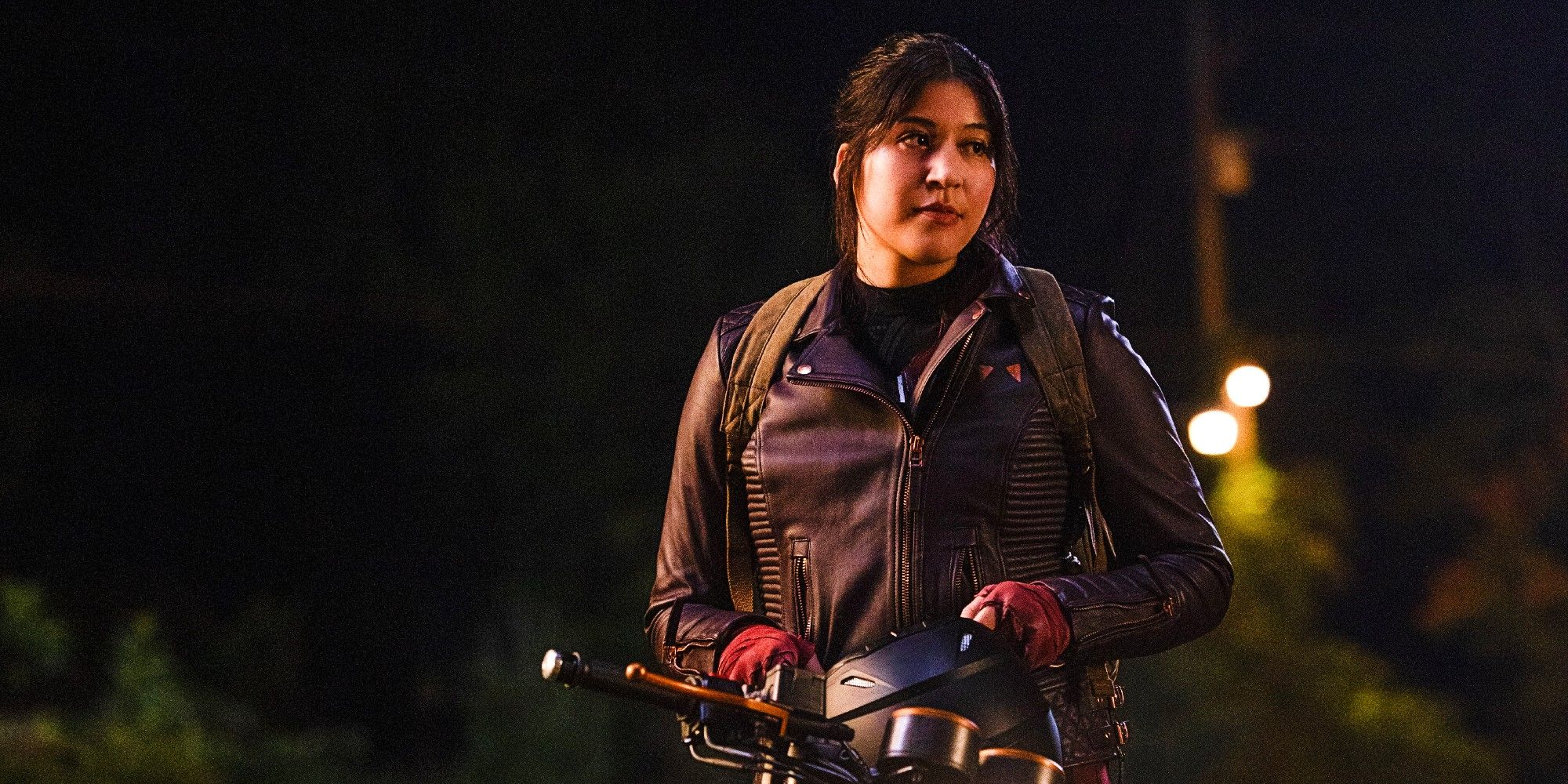 Alaqua Cox As Maya Lopez Standing Beside A Motorcycle In Echo Season 1 Episode 3