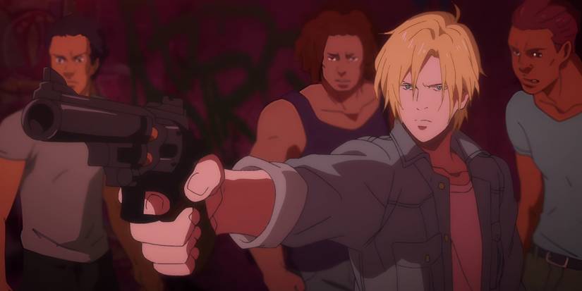 Ash holds a gun while surrounded by his gang in New York from Banana Fish.