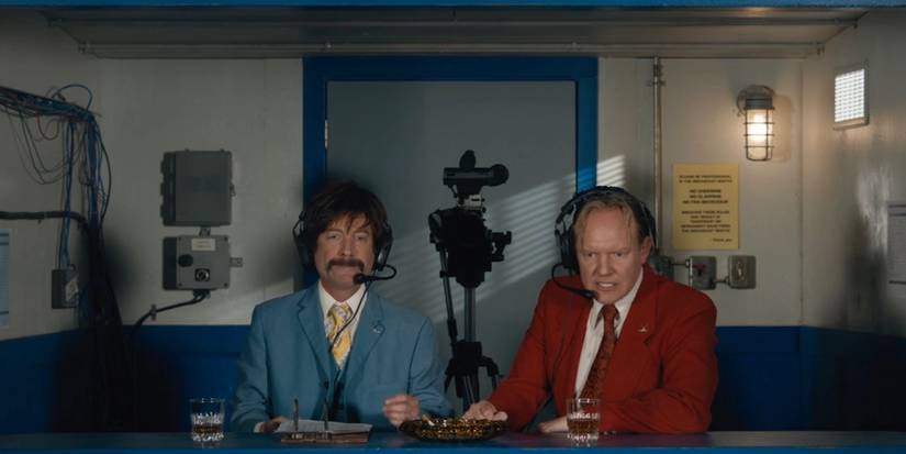 Benny and Remy sitting in the commentator's box in Shoresy