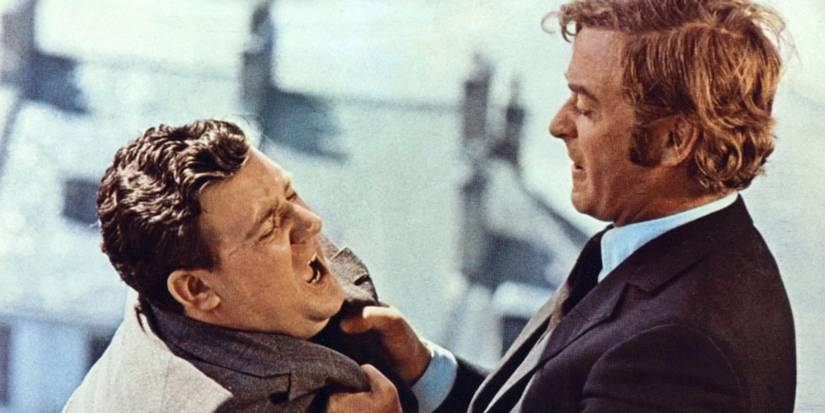 Michael Caine as Jack Carter, holding a man by the lapels in Get Carter