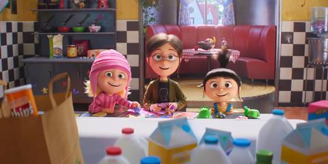 Gru's three daughters sitting at the kitchen table from the Despicable Me 4 movie trailer