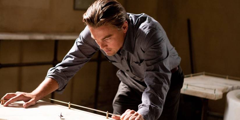 Cobb staring at his totum in Inception