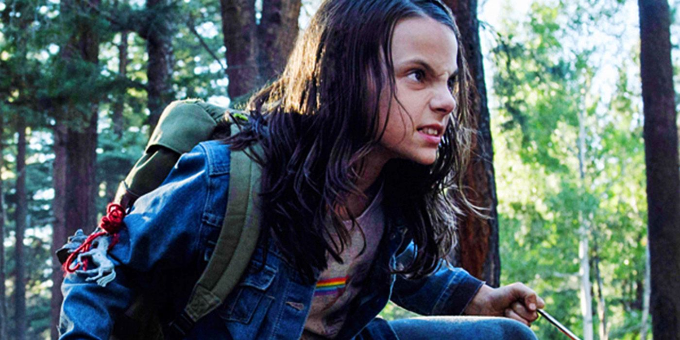 Dafne Keen's X-23 in Logan, crouching, snarling, and wielding her claws