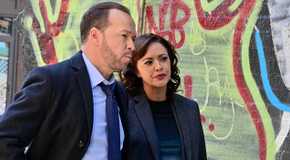 Danny and Baez in Blue Bloods next to graffiti wall