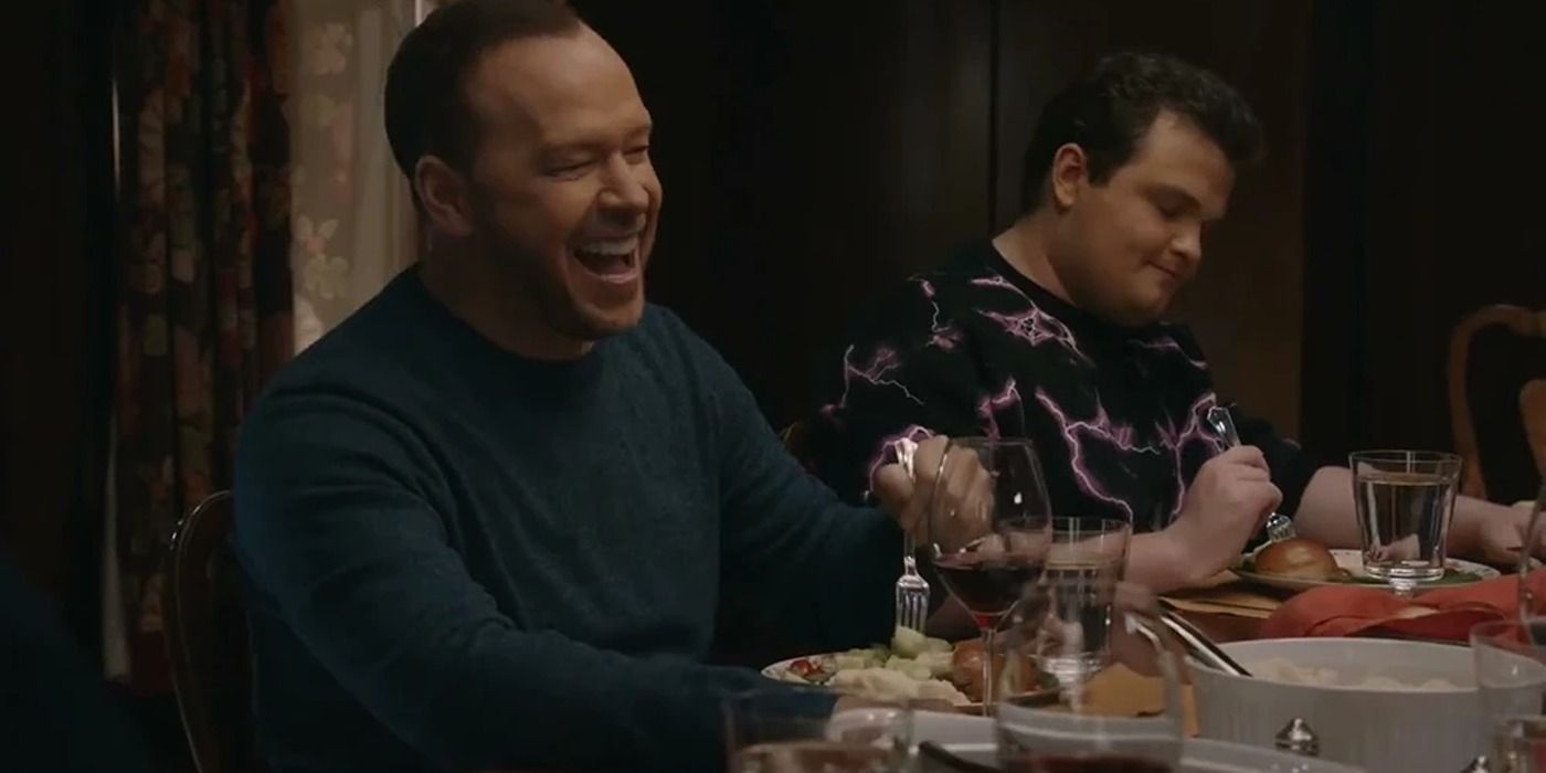 Danny (Donny Wahlberg) laughing and eating dinner in Blue Bloods