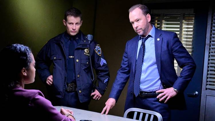 Danny (Donnie Wahlberg) and Jamie Reagan (Will Estes) interview a suspect in Blue Bloods