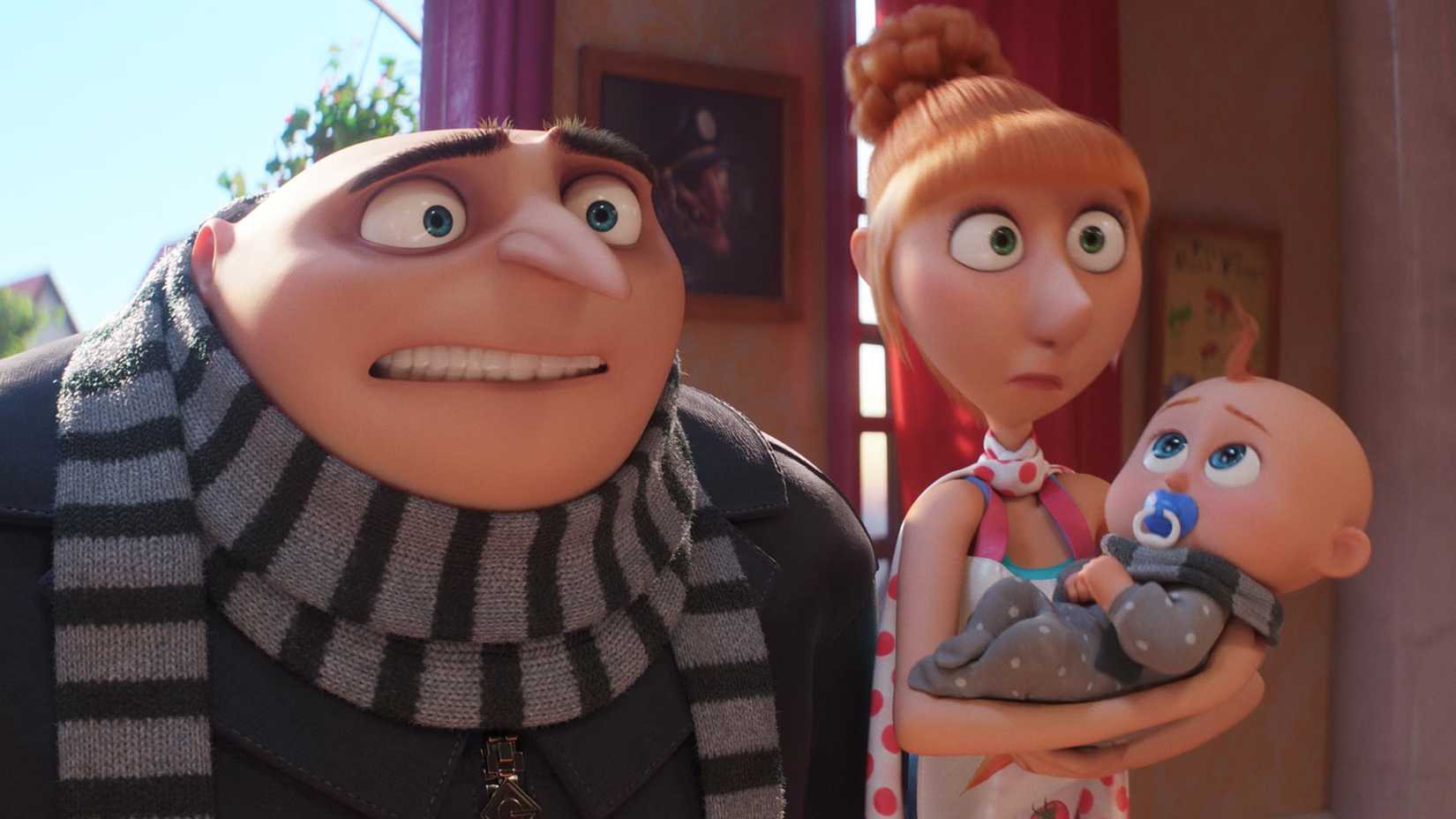 Gru and Lucy standing side by side while Lucy holds their son in Despicable Me 4