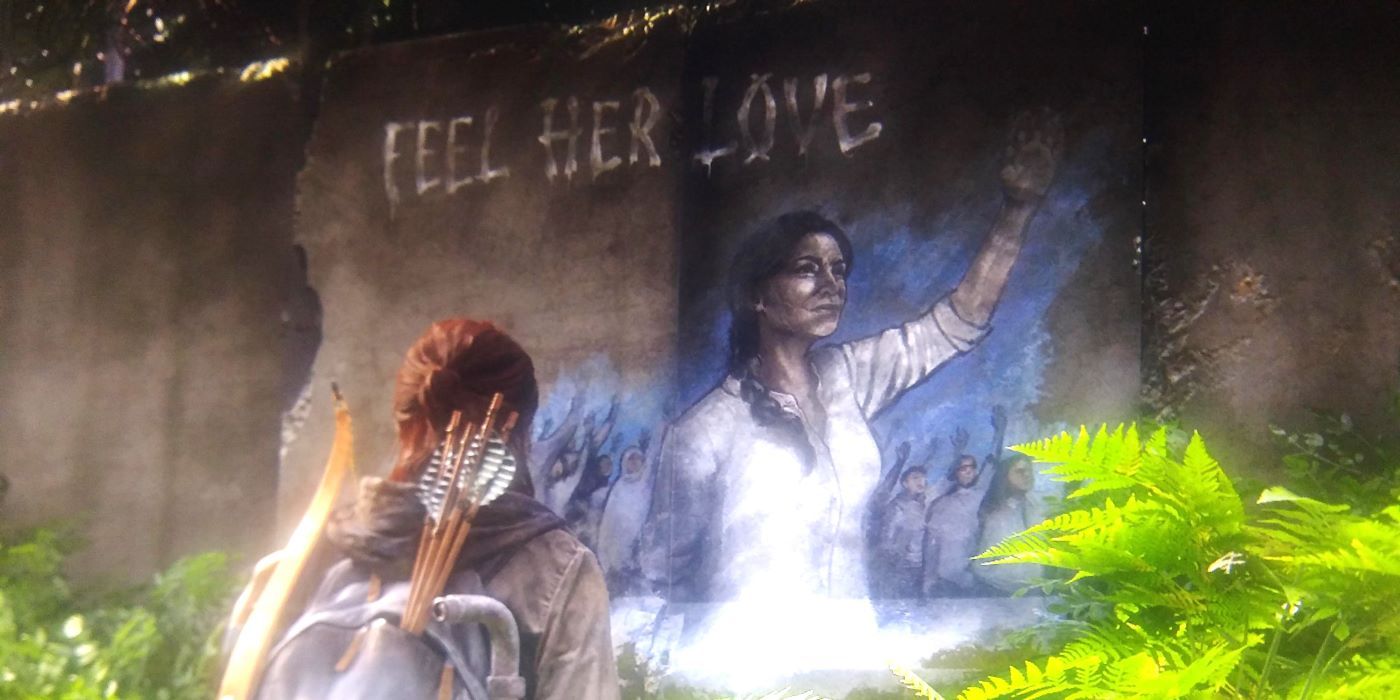 Ellie looking at a mural of the Seraphite Prophet in The Last of Us Part II