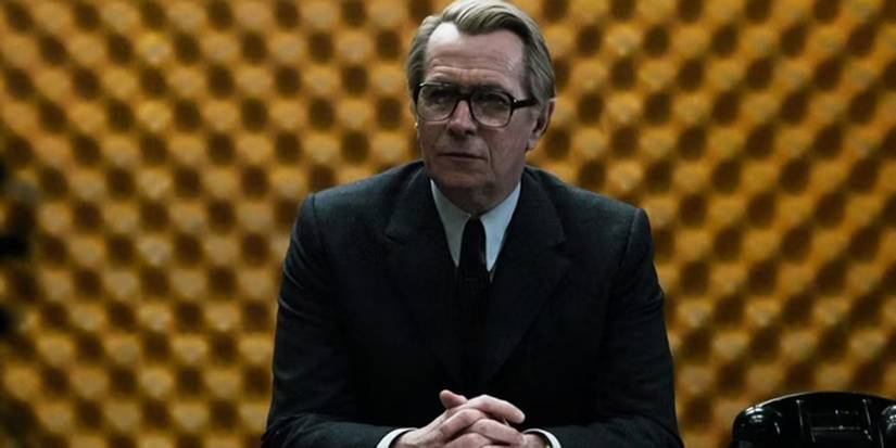 George Smiley in a meeting room in Tinker Tailor Soldier Spy