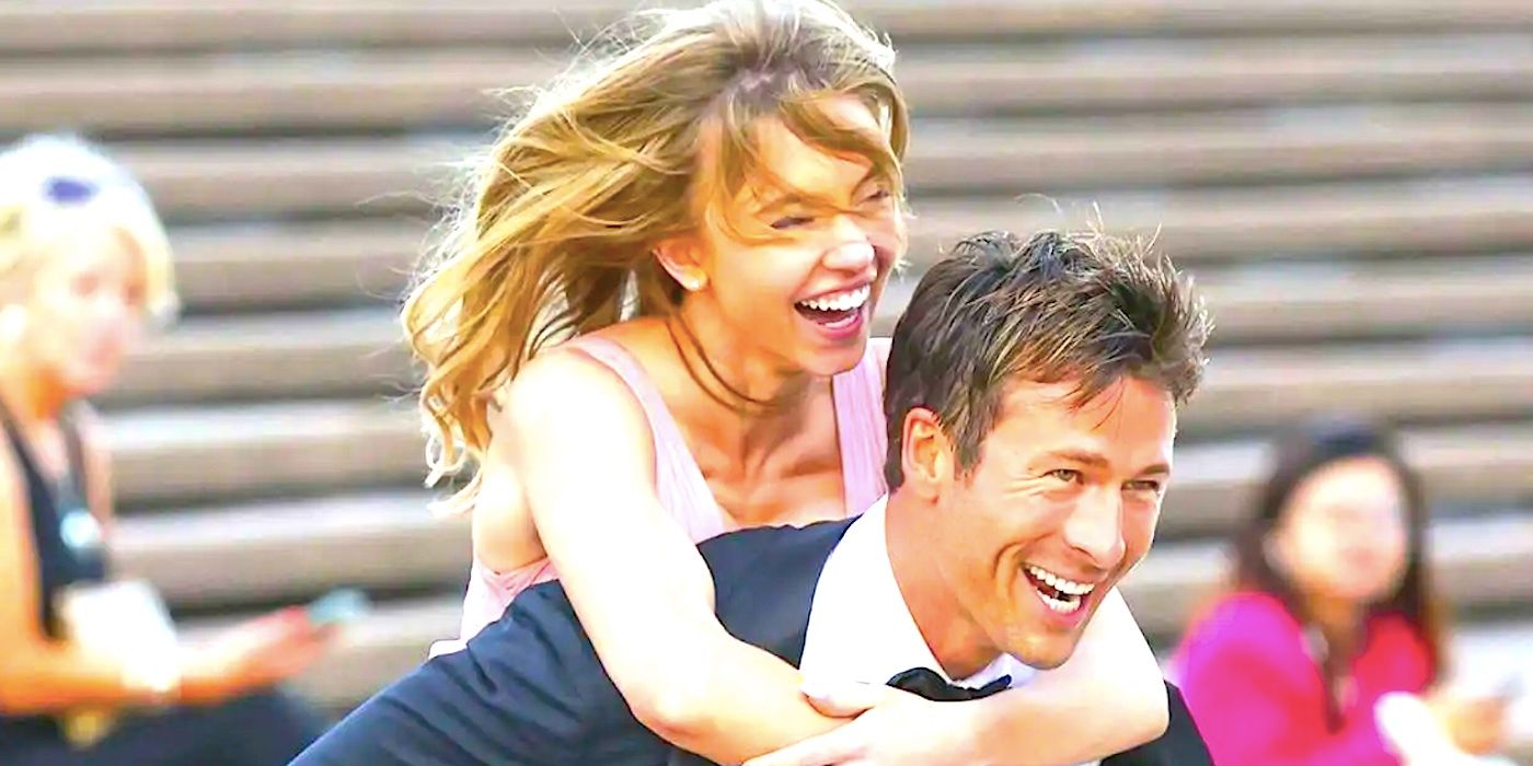 Glen Powell's grinning Ben gives Syndey Sweeney's laughing Bea a piggyback in Anyone But You