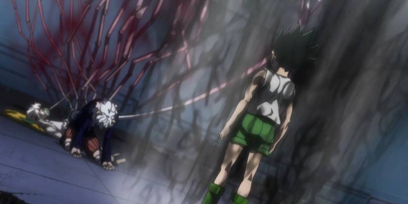 Gon confronting Neferpitou while she attempts to heal Komugi in Hunter x Hunter