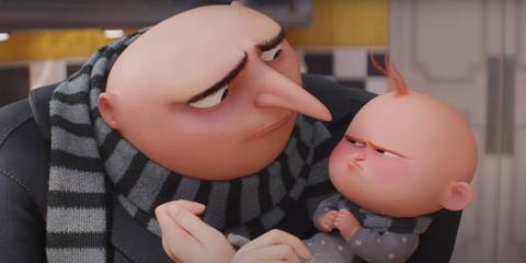 Gru holding his son, who is pouting, in Despicable Me 4 trailer