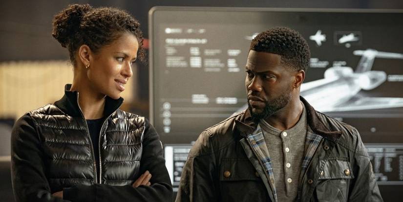 Gugu Mbatha-Raw as Abby Gladwell and Kevin Hart as Cyrus scowling at each other in Netflix's Lift