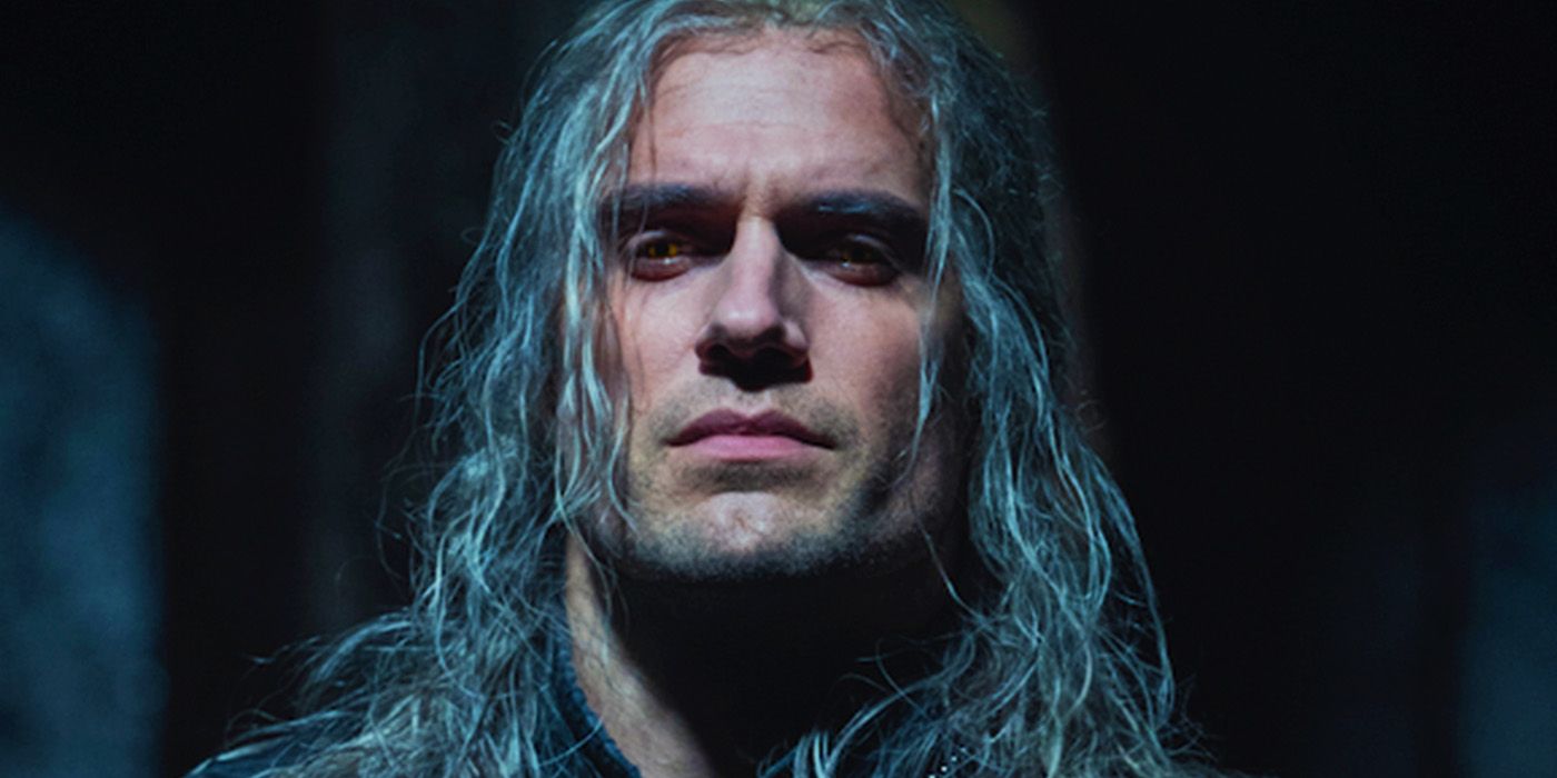 Henry Cavill looking down with an angry expression in The Witcher