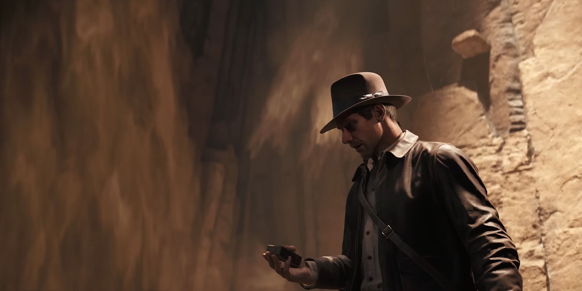 Indiana Jones looking scared and holding a relic in the Indiana Jones and the Great Circle game