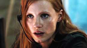 Jessica Chastain looking intently with a headset on in Zero Dark Thirty