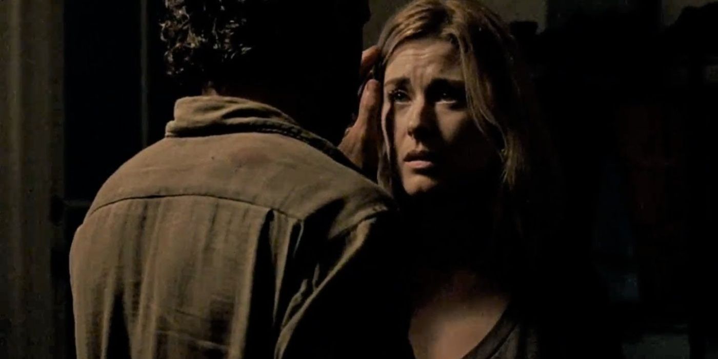 Jessie (Alexandra Breckenridge) looking scared as Rick brushes her hair back in The Walking Dead