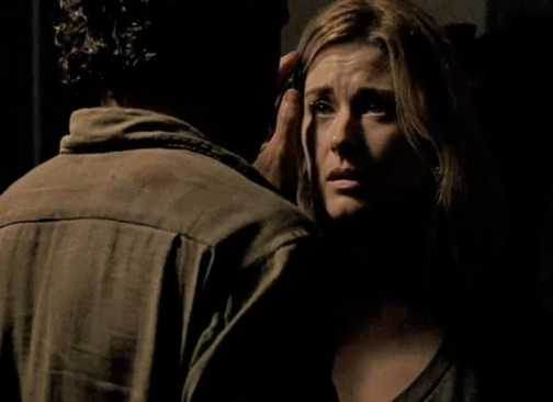 Jessie (Alexandra Breckenridge) looking scared as Rick brushes her hair back in The Walking Dead