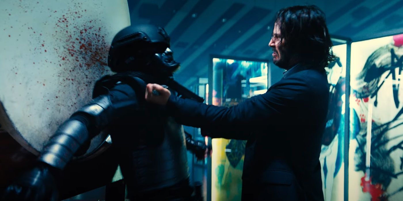 John shoots a goon in the head in John Wick Chapter 4