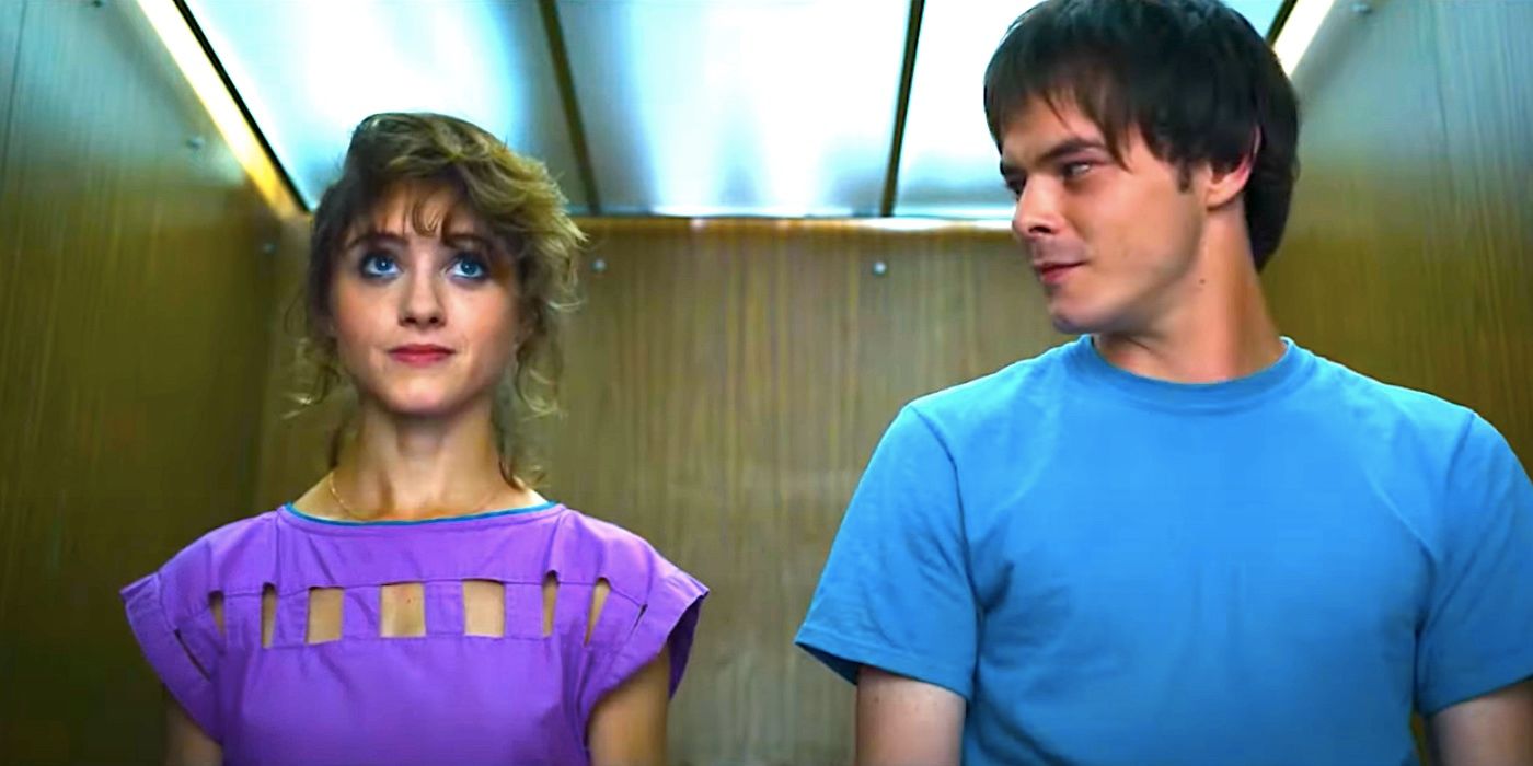 Charlie Heaton's Jonathan and Natalie Dyer's Nancy smiling in an elevator in Stranger Things season 3