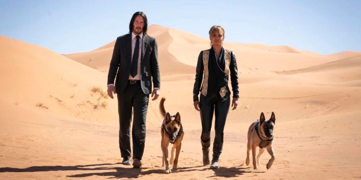 Keanu Reeves as John Wick and Halle Berry as Sofia Al-Azwar walk through a desert in between Lerna and Orthrus in John Wick: Chapter 3 - Parabellum.