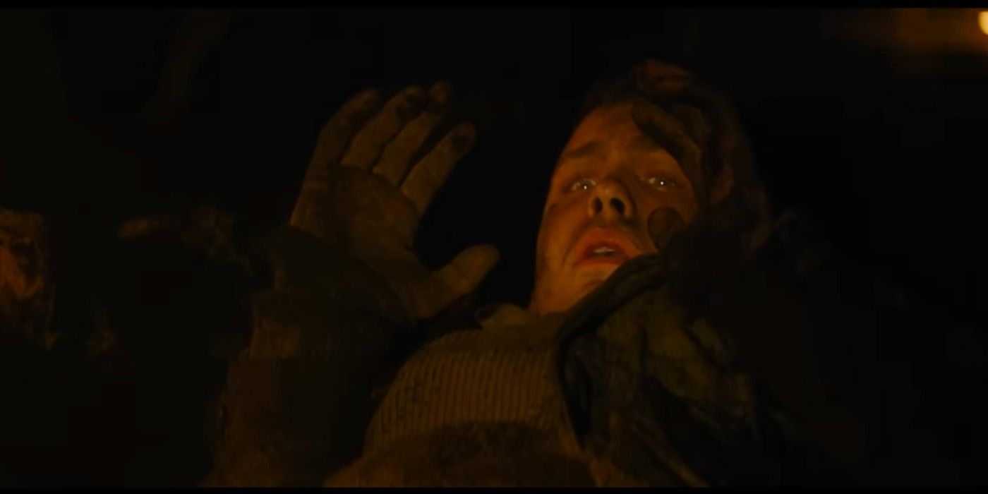 Logan Lerman as Norman Ellison surrendering in Fury