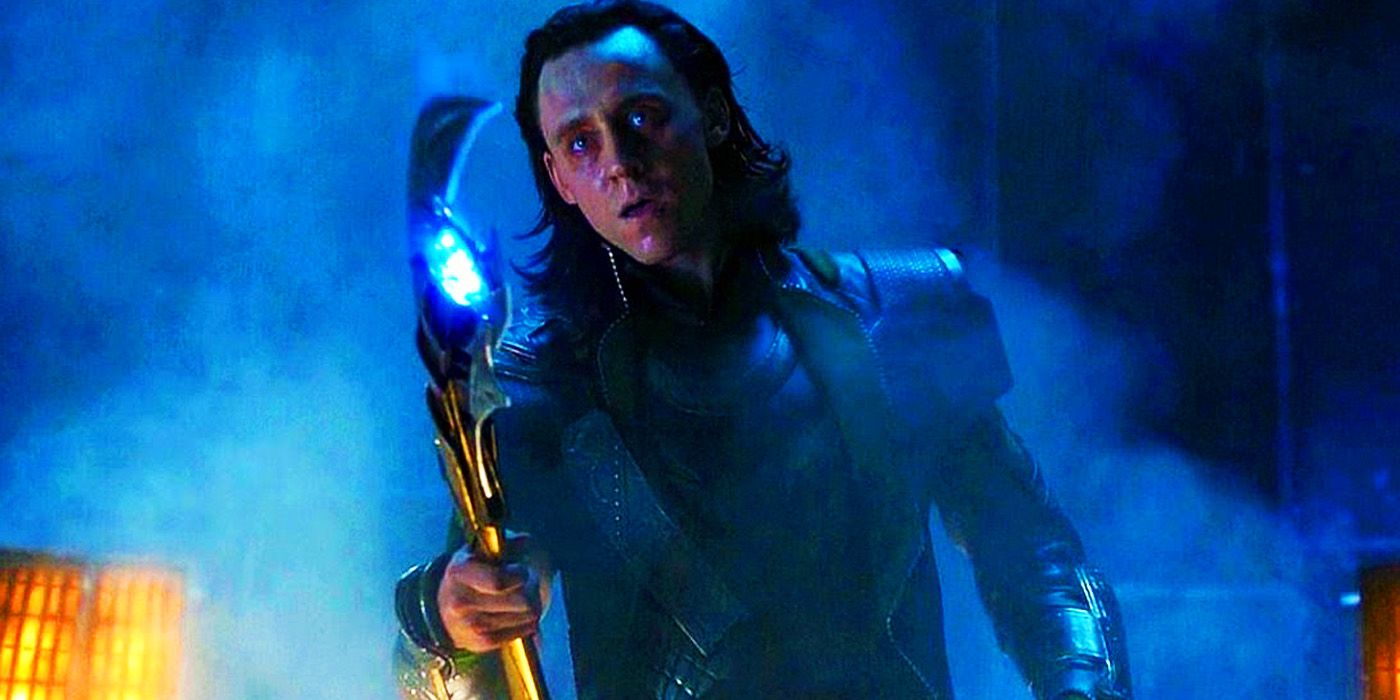 Tom Hiddleston as Loki holding out his scepter in The Avengers