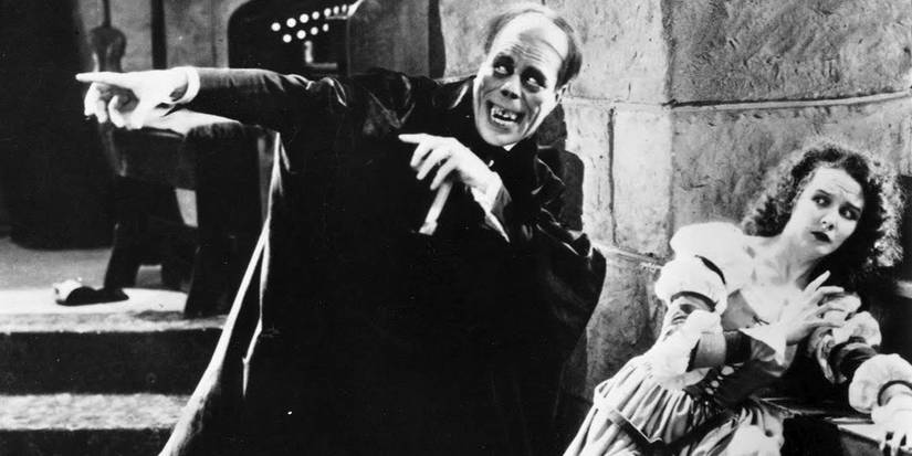 Lon Chaney Points While Mary Philbin Cowers in The Phantom of the Opera 1925