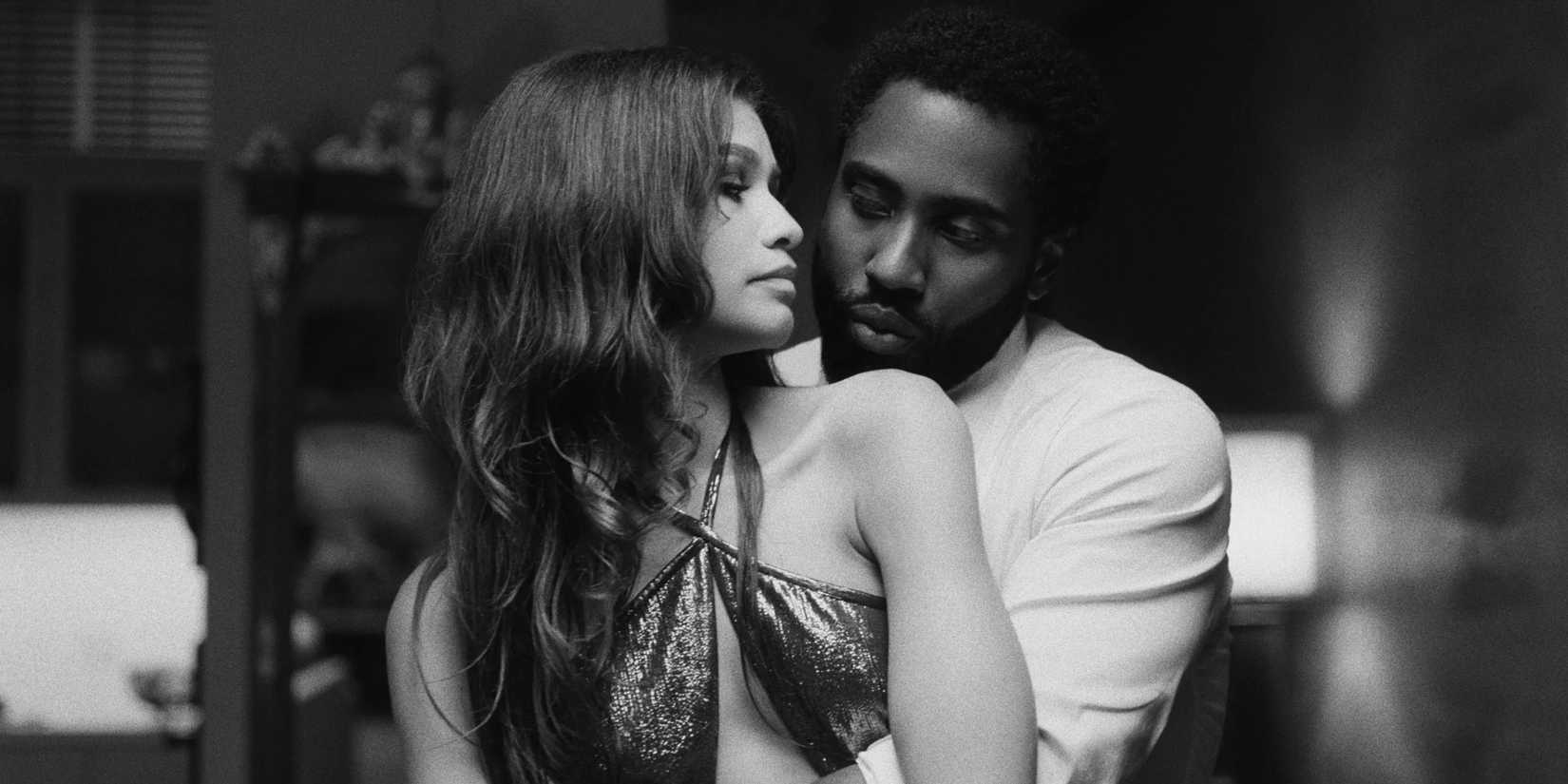 David Washington embraces Zendaya from behind as she looks back at him in Malcolm & Marie
