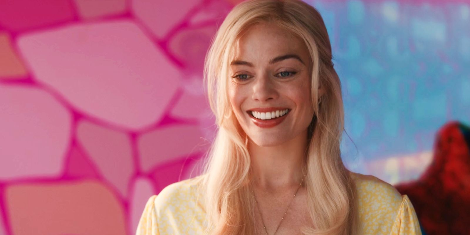 Margot Robbie as Barbie smiling widely in Barbie