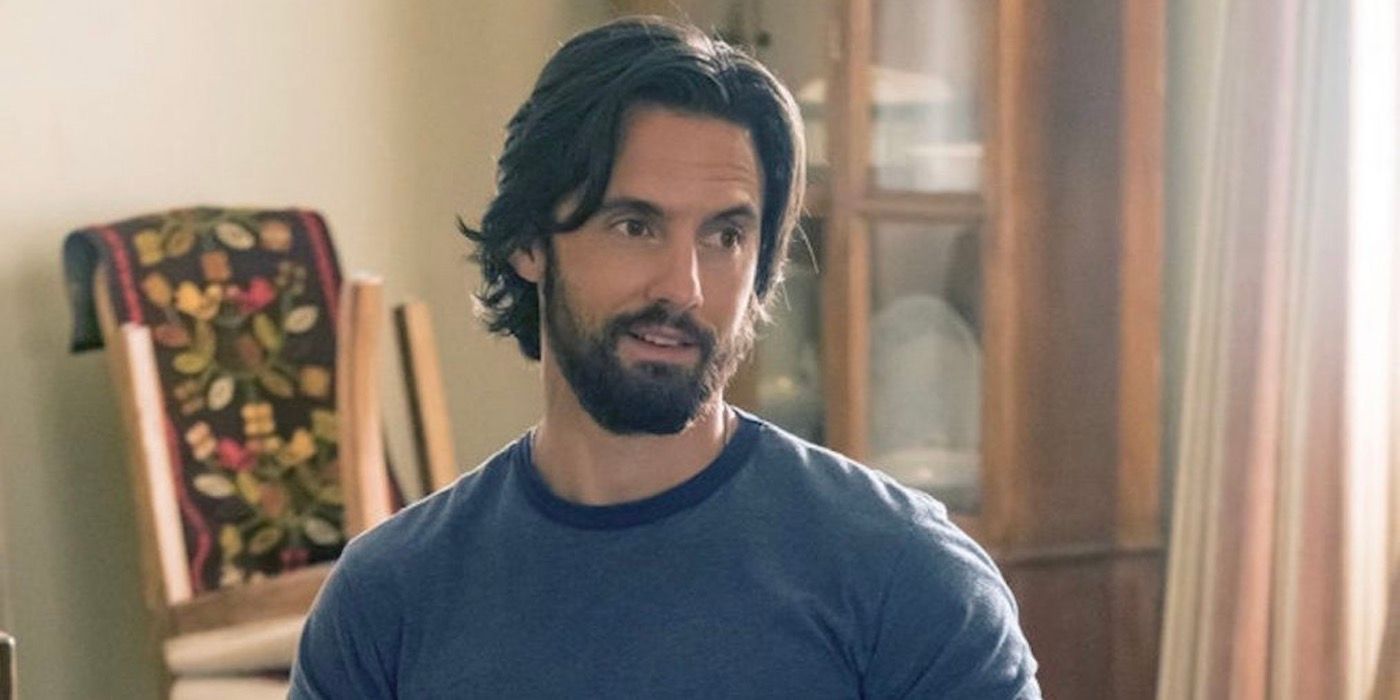 Milo Ventimiglia as Jack Pearson wearing a blue shirt and standing in dining room in This Is Us