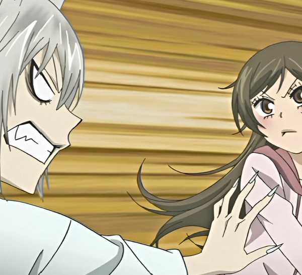 Tomoe angrily reaches for Nanami as she frowns and moves away from Kamisama Kiss.