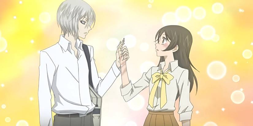 Tomoe holds Nanami's hand as he examines it from Kamisama Kiss.