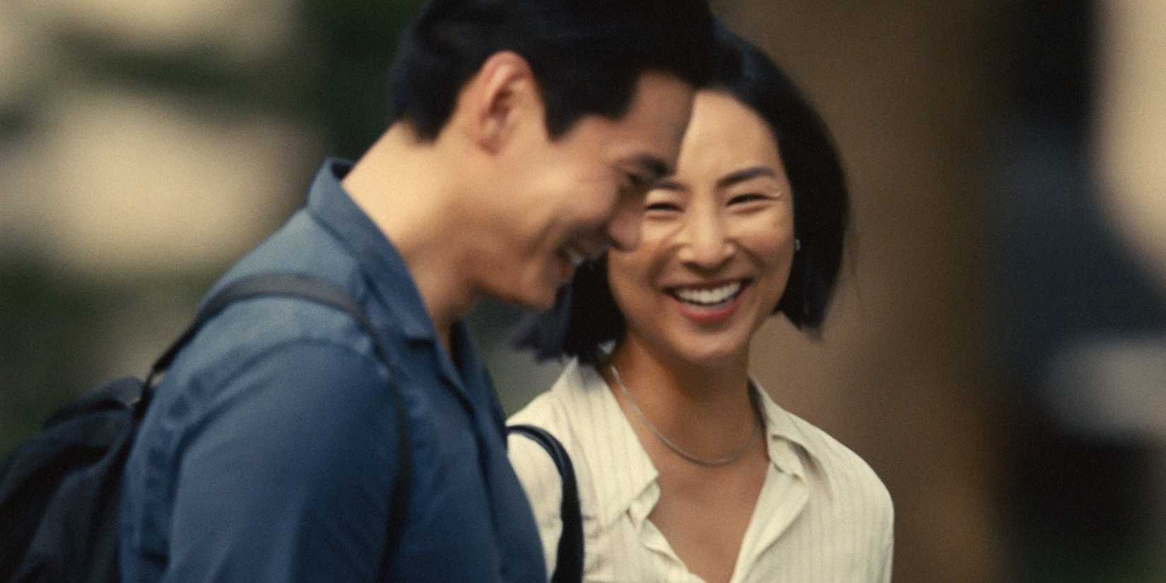 Nora (Greta Lee) laughing with Hae Sung (Teo Yoo) in Past Lives