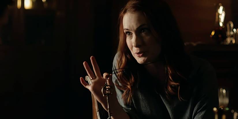 5 Years After Its Ending, Dark Fantasy Show Still Has The Most Unique Dragon Story 1 Poppy Kline holds up the Abyss Key from a string around her neck in The Magicians.