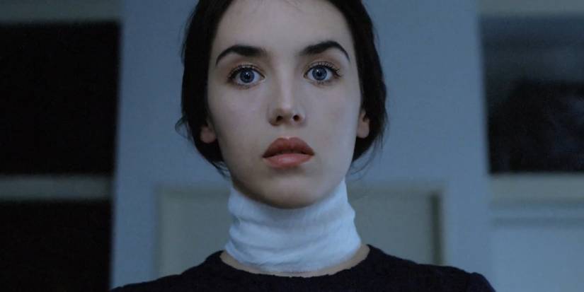 Anna (Isabelle Adjani) looking serene with a bandage around her neck in Possession