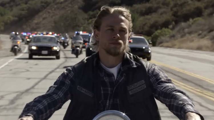 The police chasing Jax (Charlie Hunnam) on his bike in Sons of Anarchy