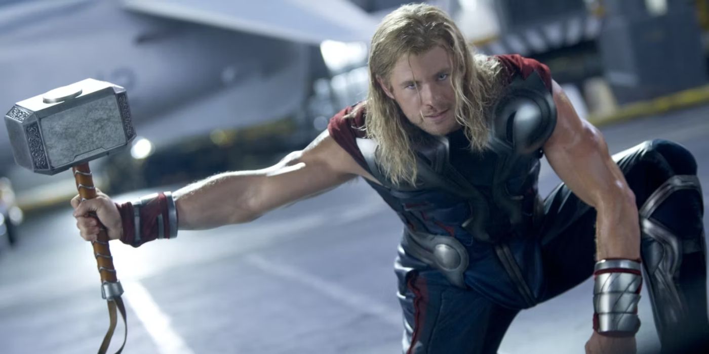 Chris Hemsworth's Thor with Mjolnir from Avengers preparing to strike Hulk