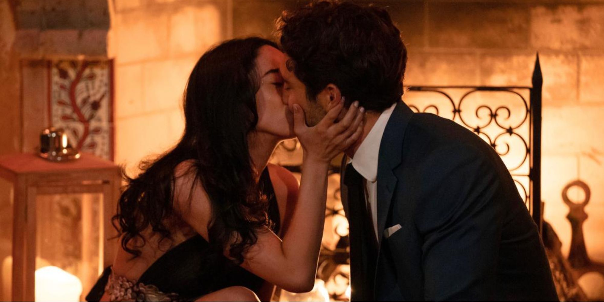 bachelor season 28 joey graziadei and maria georgas kissing with romantic background