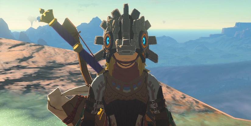 Link wears the Vah Medoh Divine Helm near a cliff in a screenshot from Zelda: TOTK.