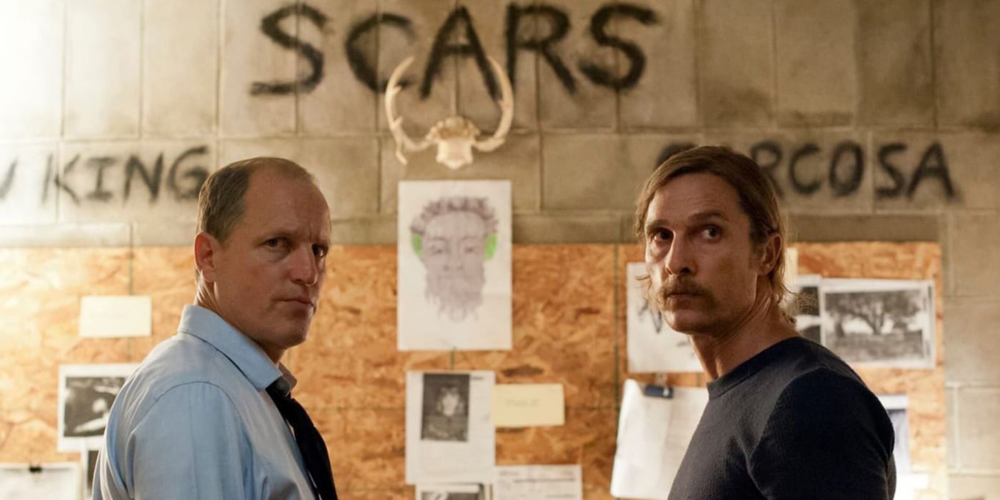 Woody Harrelson as Marty and McConaughey as Rust in front of an evidence board True Detective season 1
