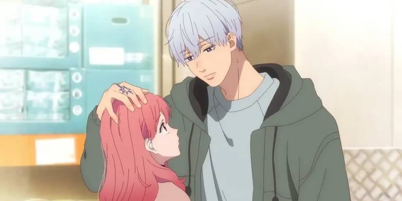 The protagonists of A Sign of Affection in a romantic and intimate moment, in which the male protagonist gently places his hand on the head of the female protagonist.