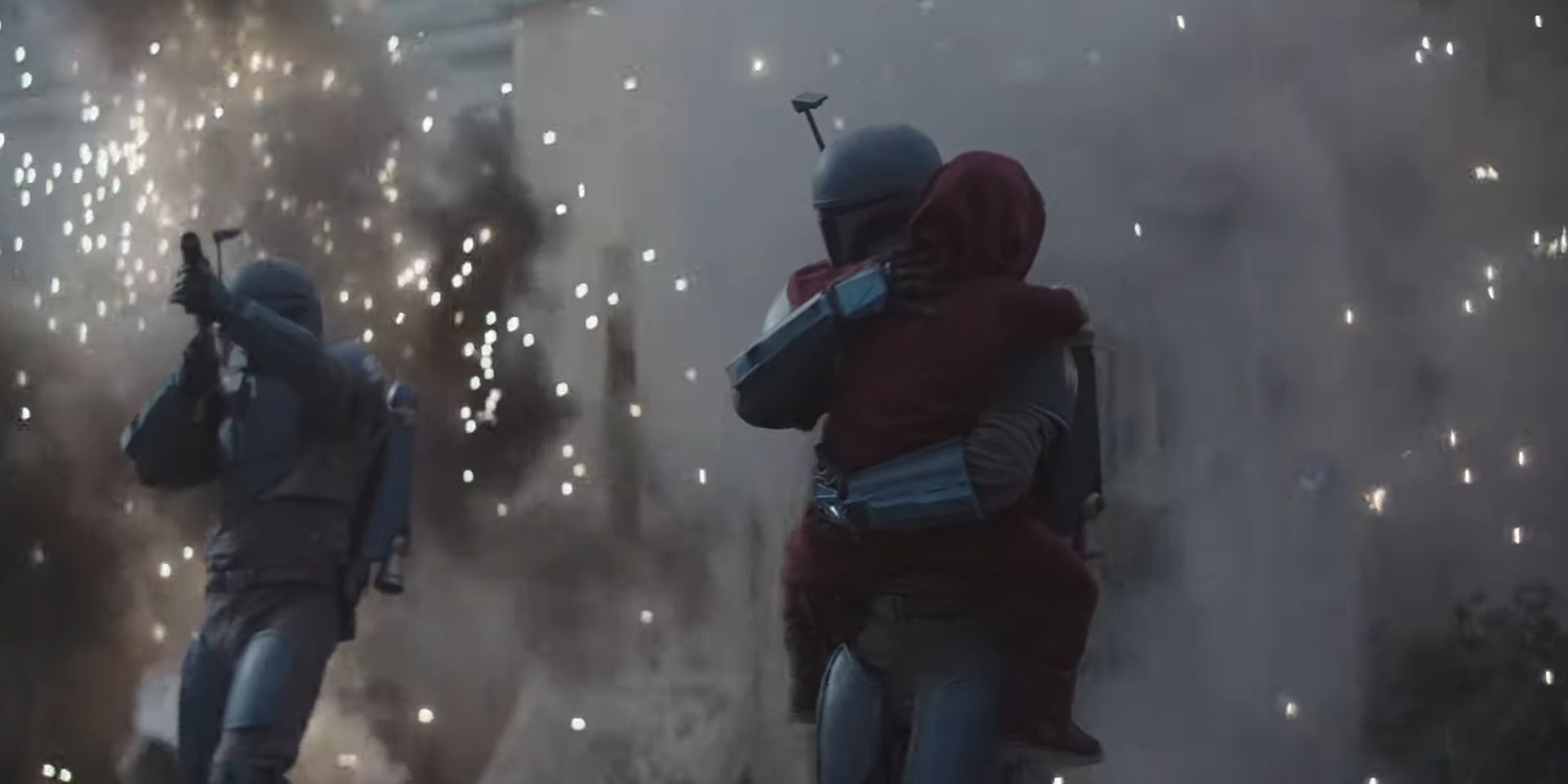 A young Din Djarin being held by the Mandalorian who saved him as they prepare to fly away from the Aq Vetina battle