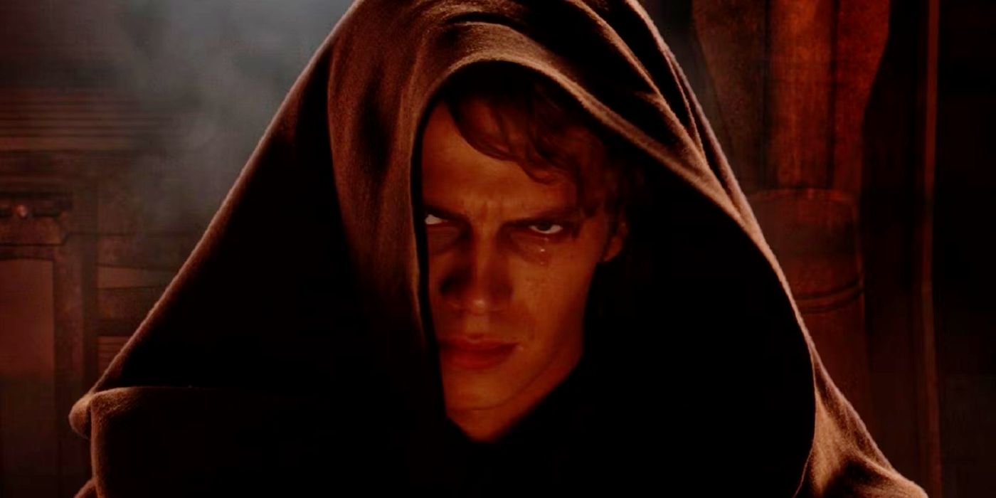 Anakin Skywalker staring at the camera with a hood on and an angry look on his face right after he agreed to become Palpatine's apprentice in Star Wars Episode III Revenge of the Sith