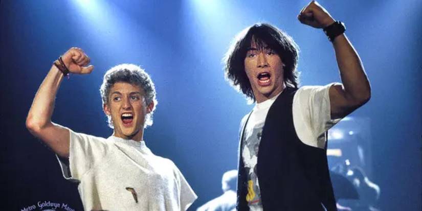Alex Winter as Bill and Keanu Reeves as Ted on stage and cheering in Bill & Ted's Excellent Adventure.
