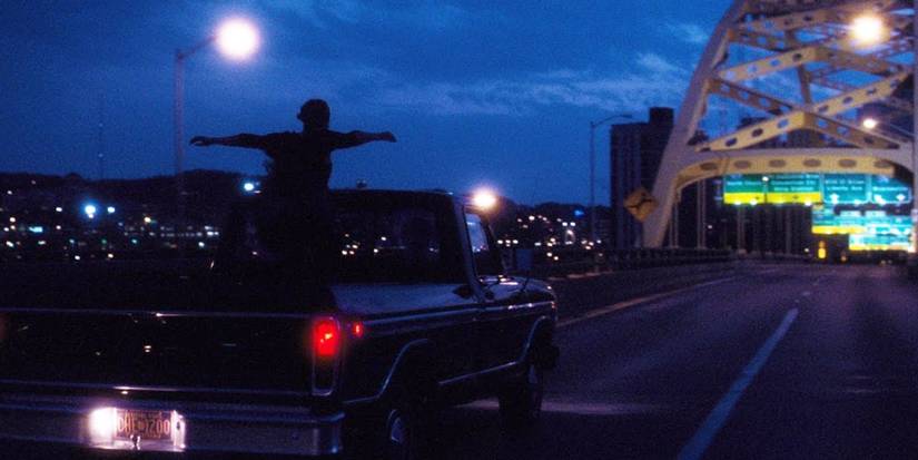 Charlie standing up in a truck in the perks of being a wallflower final scene