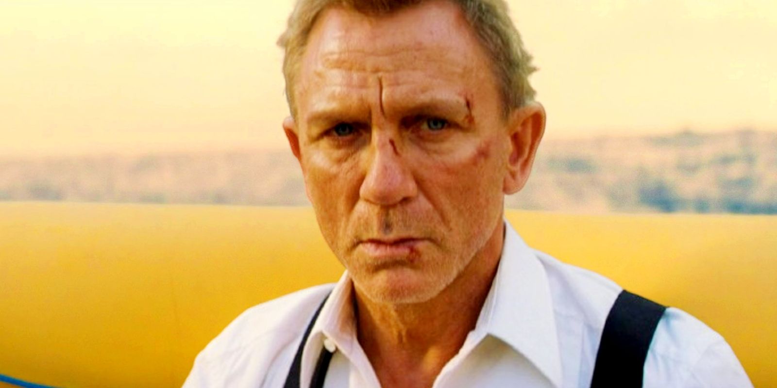 Daniel Craig as James Bond in an inflatable yellow raft in No Time To Die