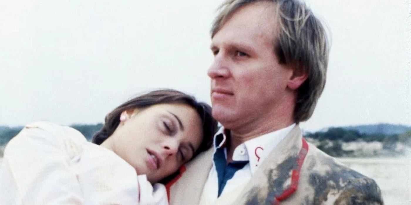 The Fifth Doctor (Peter Davison) carries Peri (Nicola Bryant) to safety in Doctor Who.