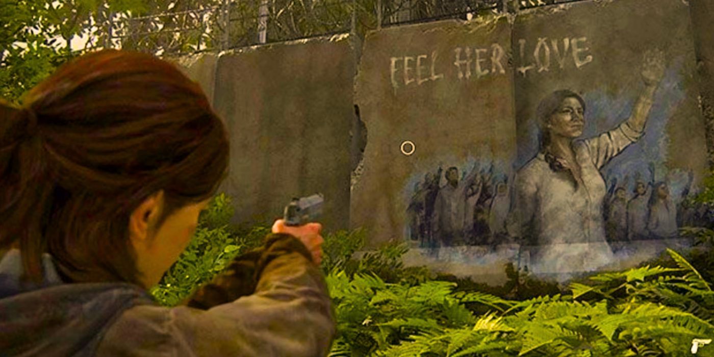 Ellie aims a gun at graffiti of the Seraphite Prophet in The Last of Us Part 2